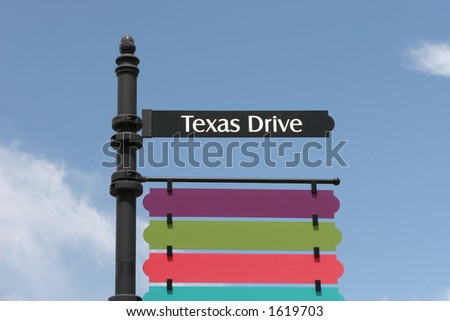 Colorful street sign showing \
