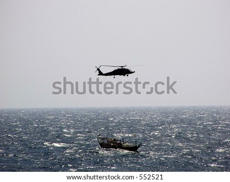 U.S Navy Helicopter Assist Sinking Boat