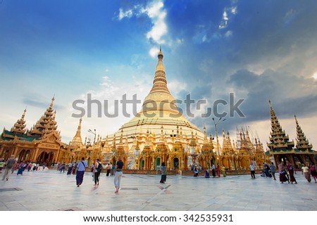 Yangon, Myanmar. Nov 18, 2015. Myanmer famous sacred place and tourist attraction landmark - Shwedagon Paya pagoda illuminated in the evening.