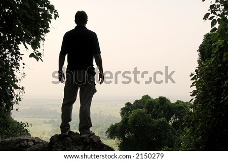 Man\'s silhouette at a viewpoint overlooking central Thailand