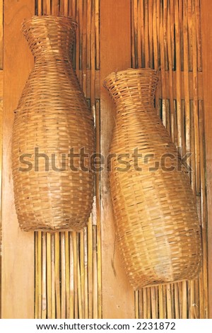 Two fish storage baskets hanging in Thailand