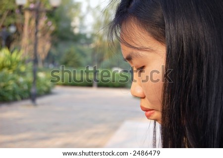 Side profile of a young Thai woman