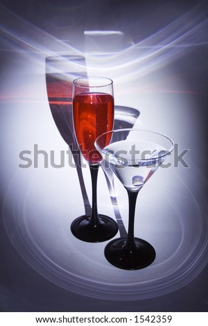 Two glasses with patches of light on a background