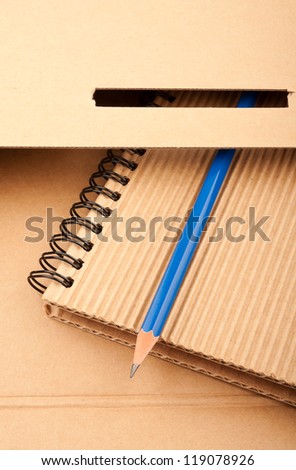 Notepad, blue pencil and paper folder