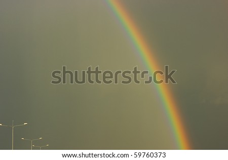 bright rainbow in the dark sky