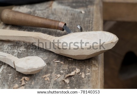 wood carving tool and spoon on the workbench
