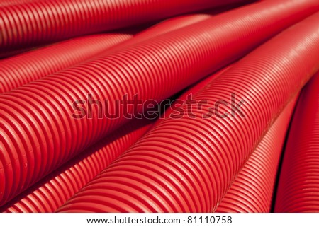 Tubing. Red plumbing pipe close-up.