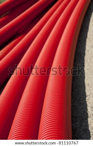 Tubing. Red plumbing pipe close-up.
