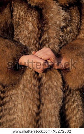 Wearing fur coat in cold winter