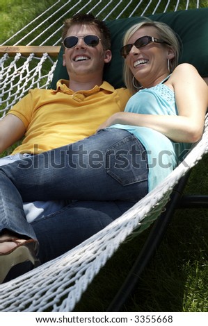 Closeup of a couple in hammock laughing