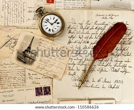 old letter and post cards with feather quill and wax seal. vintage background