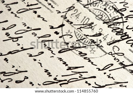 old manuscript with vintage handwriting and post stamp. abstract grungy paper background