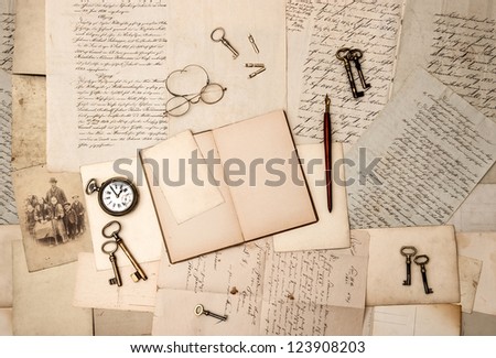 open book, vintage accessories, old letters and post cards. nostalgic background