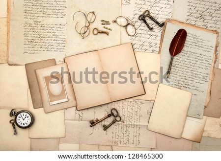 open book, vintage accessories, old letters, post cards, glasses, keys, clock. nostalgic background