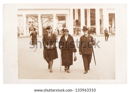 BERLIN, GERMANY - CIRCA 1920: antique street portrait of a wealthy family wearing vintage clothing, circa 1920 in Berlin, Germany
