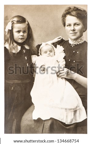 BERLIN, GERMANY - CIRCA 1918: antique portrait of mother with children wearing vintage clothing, circa 1918 in Berlin, Germany
