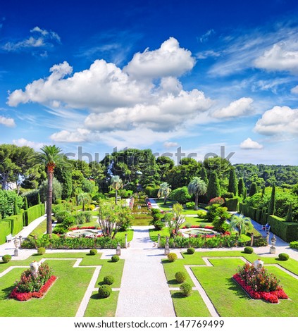 beautiful mediterranean garden on the french riviera near Nice and Monaco. landscape with cloudy blue sky