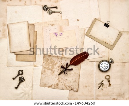 old letters and photos, vintage keys, antique clock, feather ink pen. nostalgic sentimental paper background