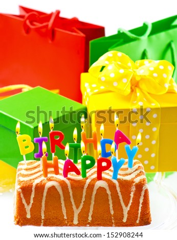 birthday cake with burning candles and gifts. happy birthday to you. card concept
