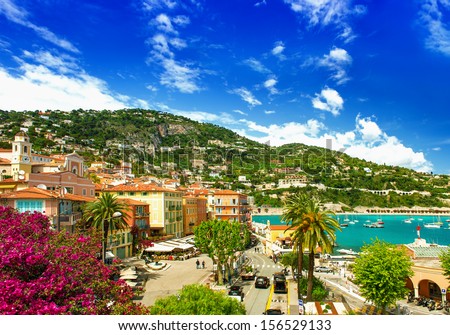 french riviera, view of luxury resort and bay of Villefranche-sur-Mer near Nice and Monaco. mediterranean sea landscape with azalea flowers