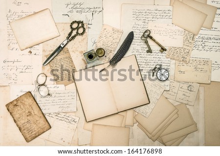 antique accessories, old letters and vintage ink pen. nostalgic sentimental paper background