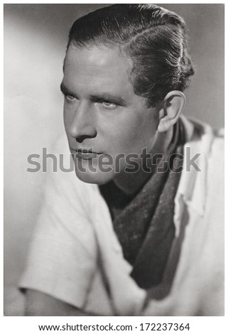 GERMANY, BERLIN - CIRCA 1930: retro style portrait of handsome young man. vintage photograph with original film grain. Illustrative Image, subject of human interest