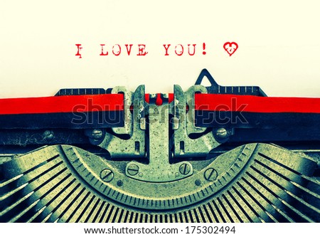 Old Typewriter With Sample Text I Love You! Red Words With Heart On White Paper. Retro Style Toned Picture