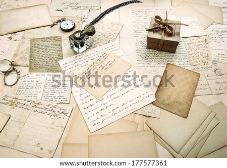 old letters, vintage postcards and antique feather pen. nostalgic sentimental background