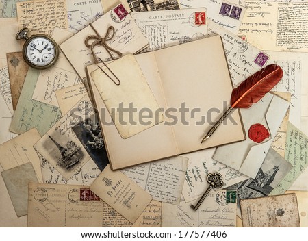 open diary book, old accessories and postcards. sentimental vintage style background