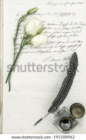 old letter, flower and antique feather pen. romantic vintage background