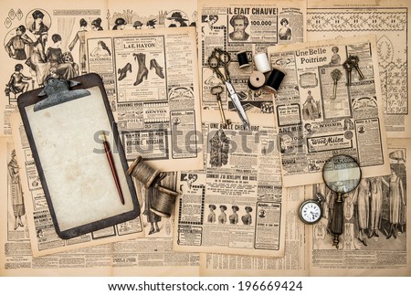 antique accessories, sewing and writing tools, vintage fashion magazine for the woman. retro style toned picture