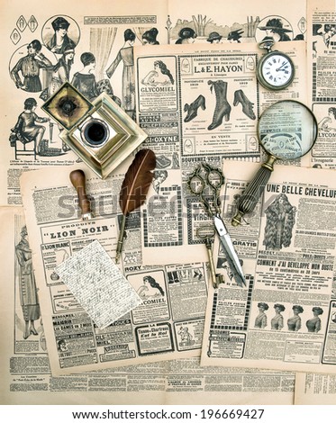 antique accessories and writing tools, vintage fashion magazine for the woman. aged paper background