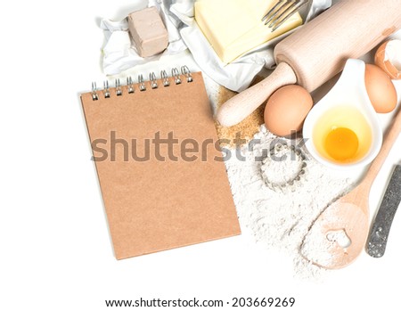 baking ingredients eggs, flour, sugar, butter, yeast and recipe book. food background. cooking with love concept