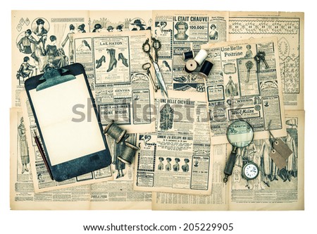 antique accessories, sewing and writing tools, vintage fashion magazine for the woman. retro style toned picture