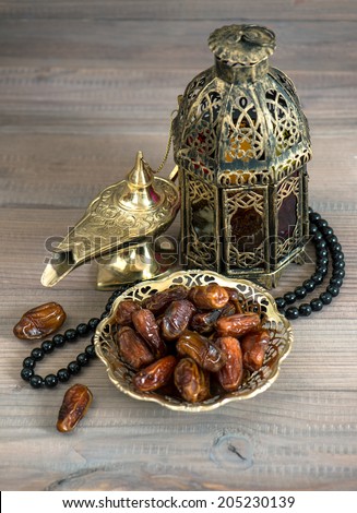 Dates, arabic lamps and rosary. Islamic holidays concept