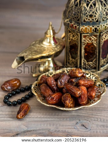 Classic arabic lamps, dates and rosary. Islamic holidays concept