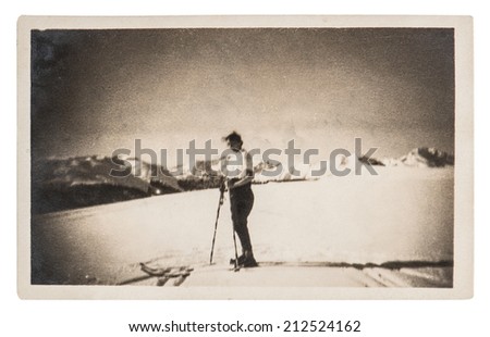 BERLIN, GERMANY - CIRCA 1929: vintage photo from skiing woman in snow. antique picture with original film grain and scratches