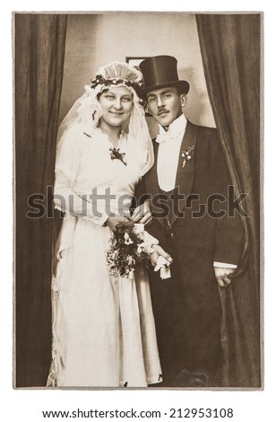 BERLIN, GERMANY - CIRCA 1930: antique wedding photo. portrait of just married couple. nostalgic picture with original scratches and film grain