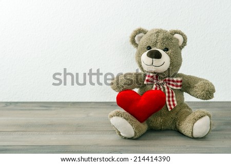 Teddy Bear with red heart. Valentines Day concept. Old toys