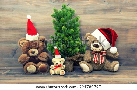 christmas decoration with vintage toys teddy bear family. retro style toned picture