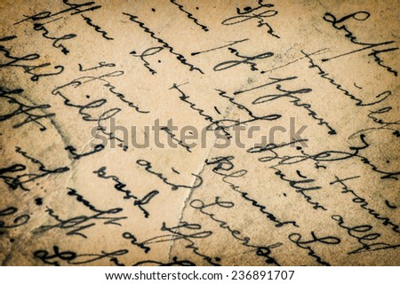 vintage handwriting. manuscript. grunge aged paper background with vignette