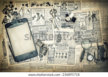 antique sewing and writing tools, vintage fashion magazine for the woman. clipboard for your text. retro style toned picture