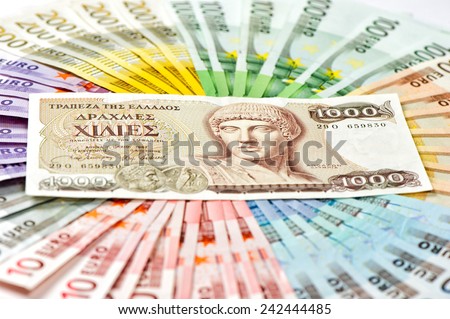 old greek drachma and euro cash banknotes. greece euro crisis concept. selective focus