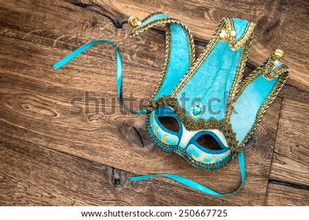 Blue carnival mask harlequin. Holidays background. Symbol of venetian mask festival