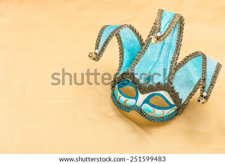 Blue carnival mask harlequin. Holidays background. Symbol of venetian mask festival.