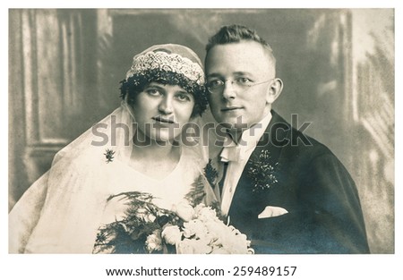 BERLIN, GERMANY - CIRCA 1935: original antique wedding photo. portrait of just married couple. vintage picture with original film grain and blur