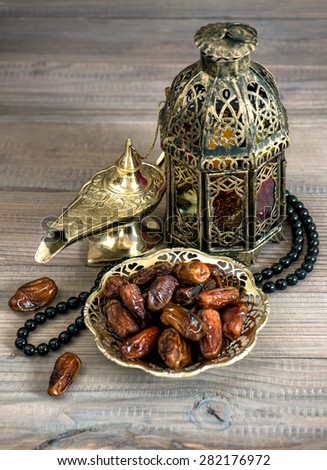 Dates, arabic lamps and rosary. Islamic holidays concept. Festive decoration