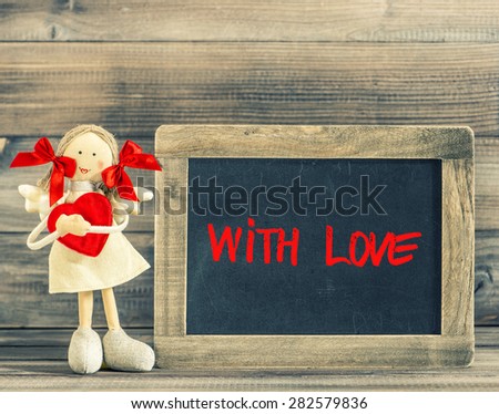 Sweet girl with Red Heart. Holidays decoration. Blackboard sample text With Lowe