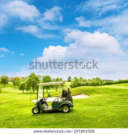Golf course landscape with a cart and green field over blue sky. Nature background