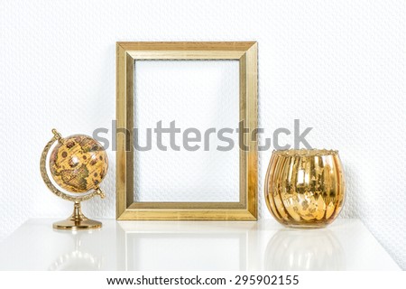 Golden picture frame with decorations. Mock up for your photo or text Vase and globe no name products